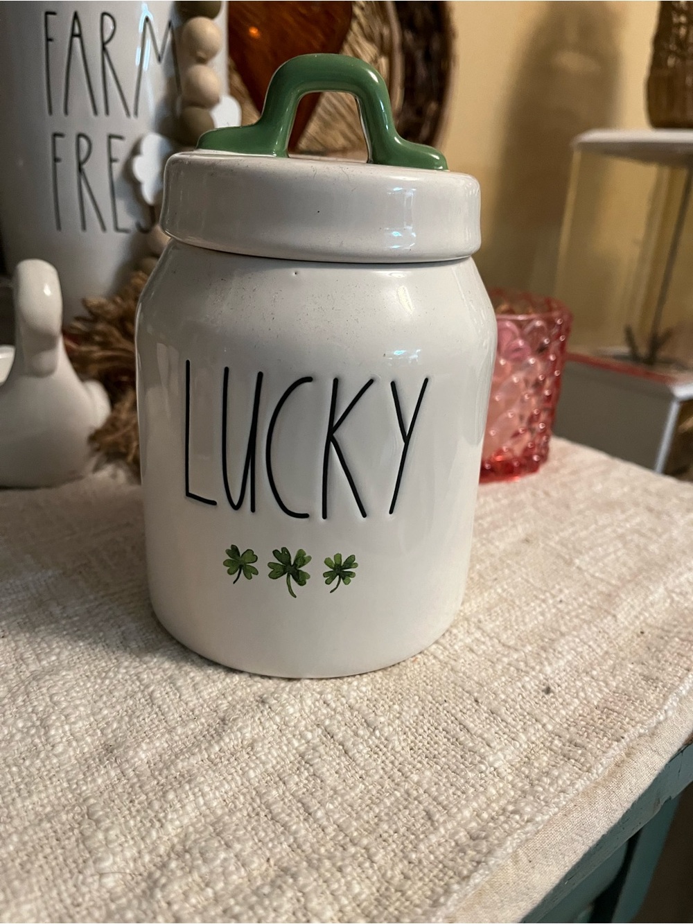 Rae Dunn White Ceramic "LUCKY" Canister with Green Handle and Shamrocks